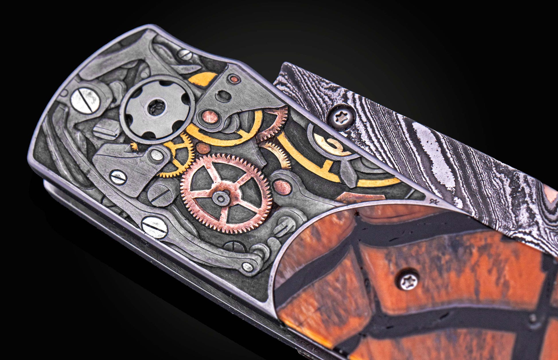 William Henry knife with woolly mammoth tusk, hand engraving, and damascus steel blade.