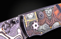 William Henry knife with woolly mammoth tusk, hand engraving, and damascus steel blade.