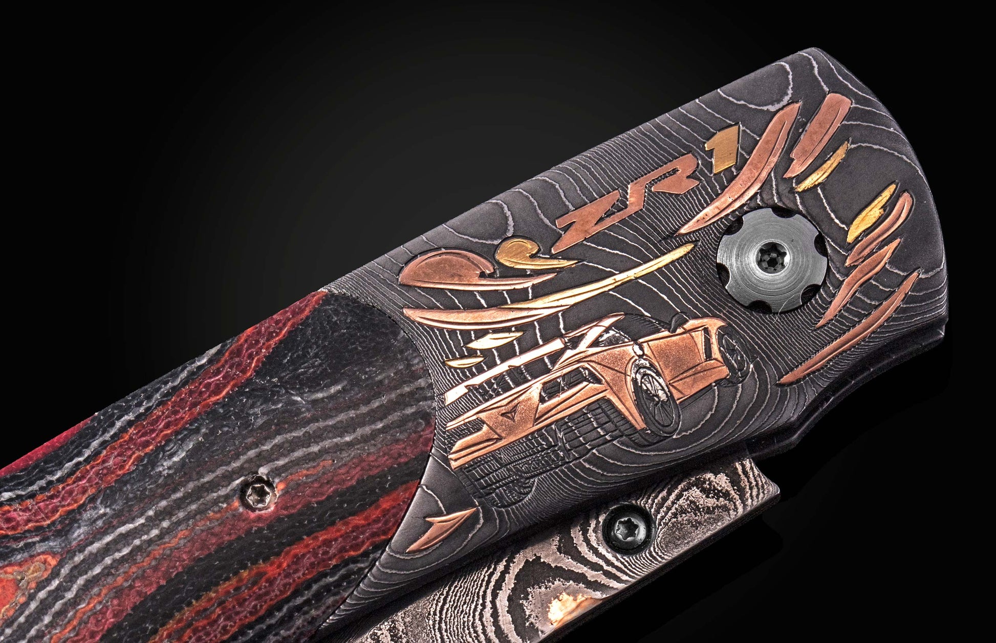 Luxury B12 ZR1 knife with black and red marbled handle, copper inlay of sports car and "ZR1" script, textured grip, side view close-up