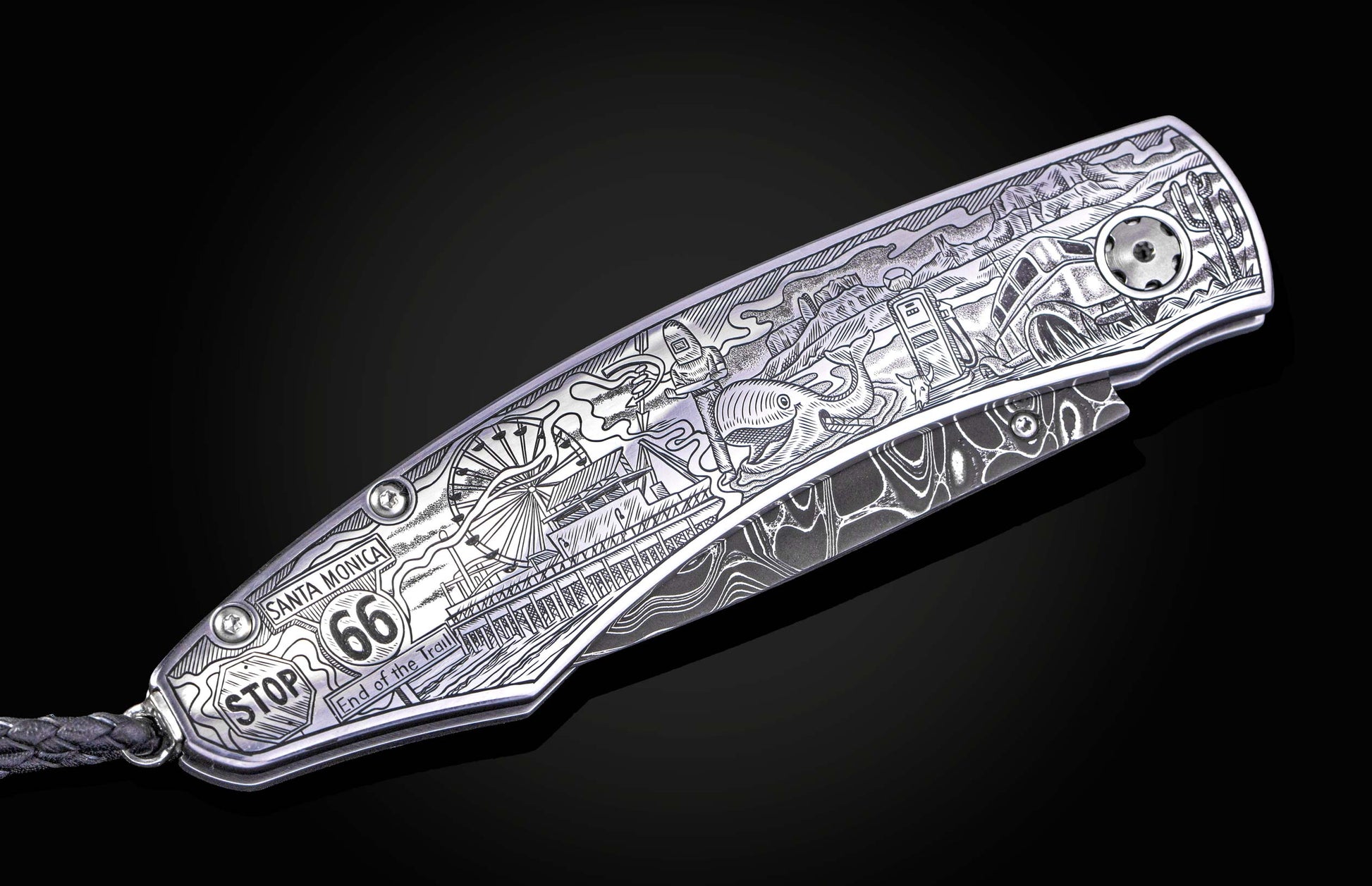 Hand engraved William Henry knife with depictions of Route 66 on a black background