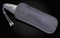 Hand engraved William Henry knife with depictions of Route 66 on a black background