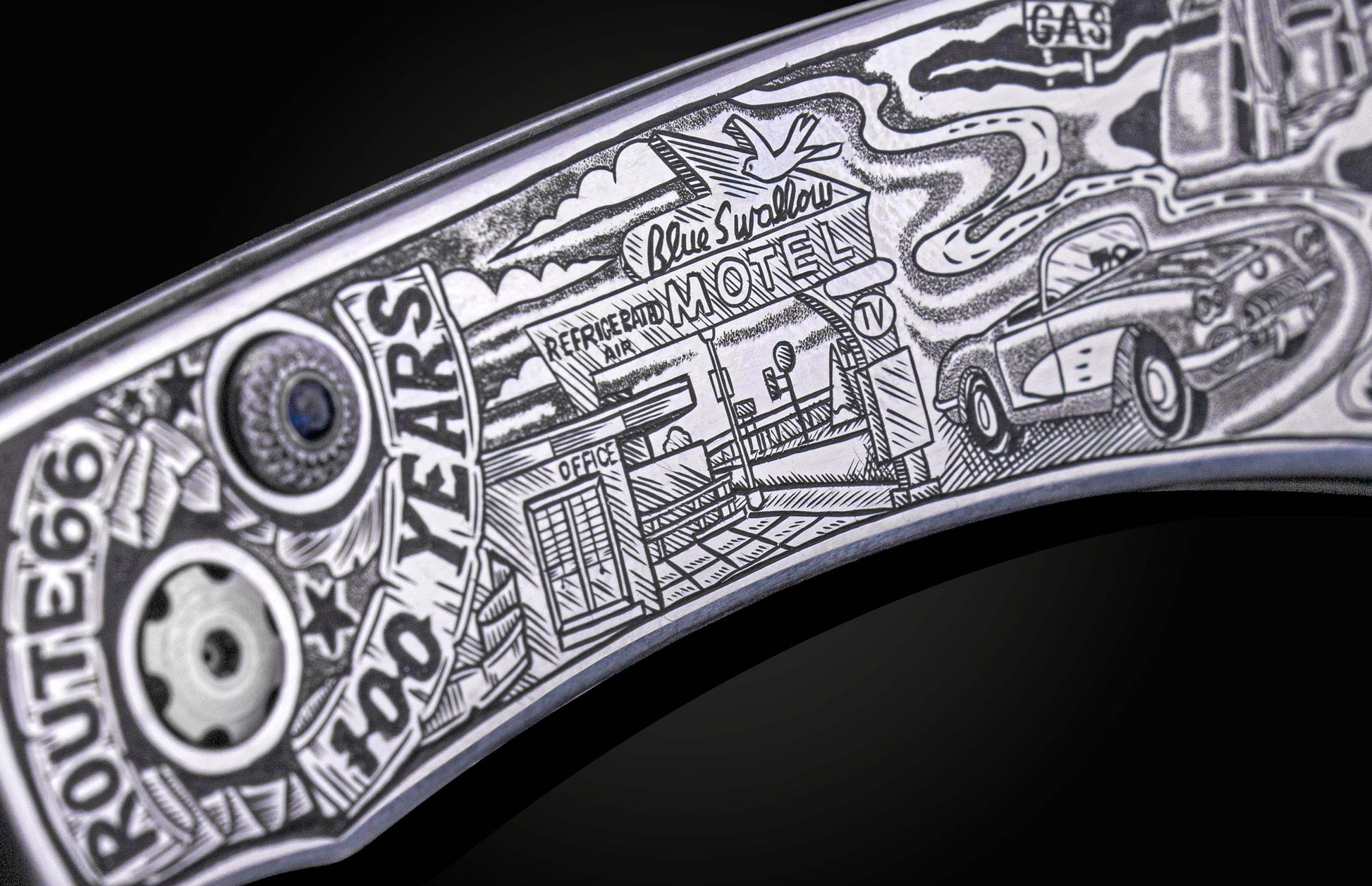 Hand engraved William Henry knife with depictions of Route 66 on a black background