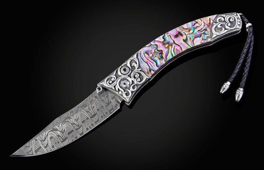 Decorative knife with a colorful handle on a black background