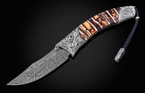 Decorative knife with a patterned blade and wooden handle on a black background