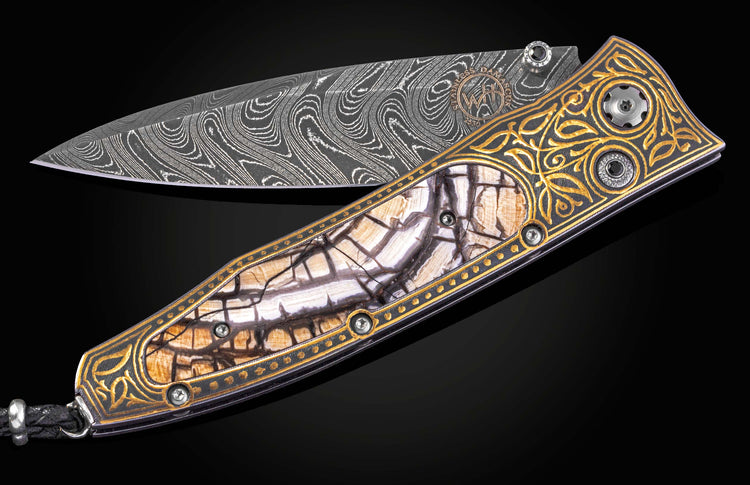 William Henry folding knife with gold koftgari designs, fossil wooly mammoth tusk, and damascus steel blade