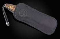 William Henry folding knife with gold koftgari designs, fossil wooly mammoth tusk, and damascus steel blade