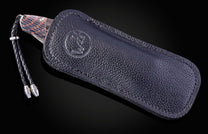 William Henry knife featuring coper & carbon fiber scales and a superconductor frame