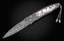 William Henry folding knife with damascus steel and white turquoise in bornze.