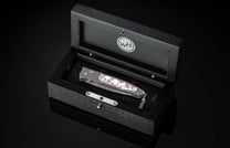 William Henry folding knife with damascus steel and white turquoise in bornze.