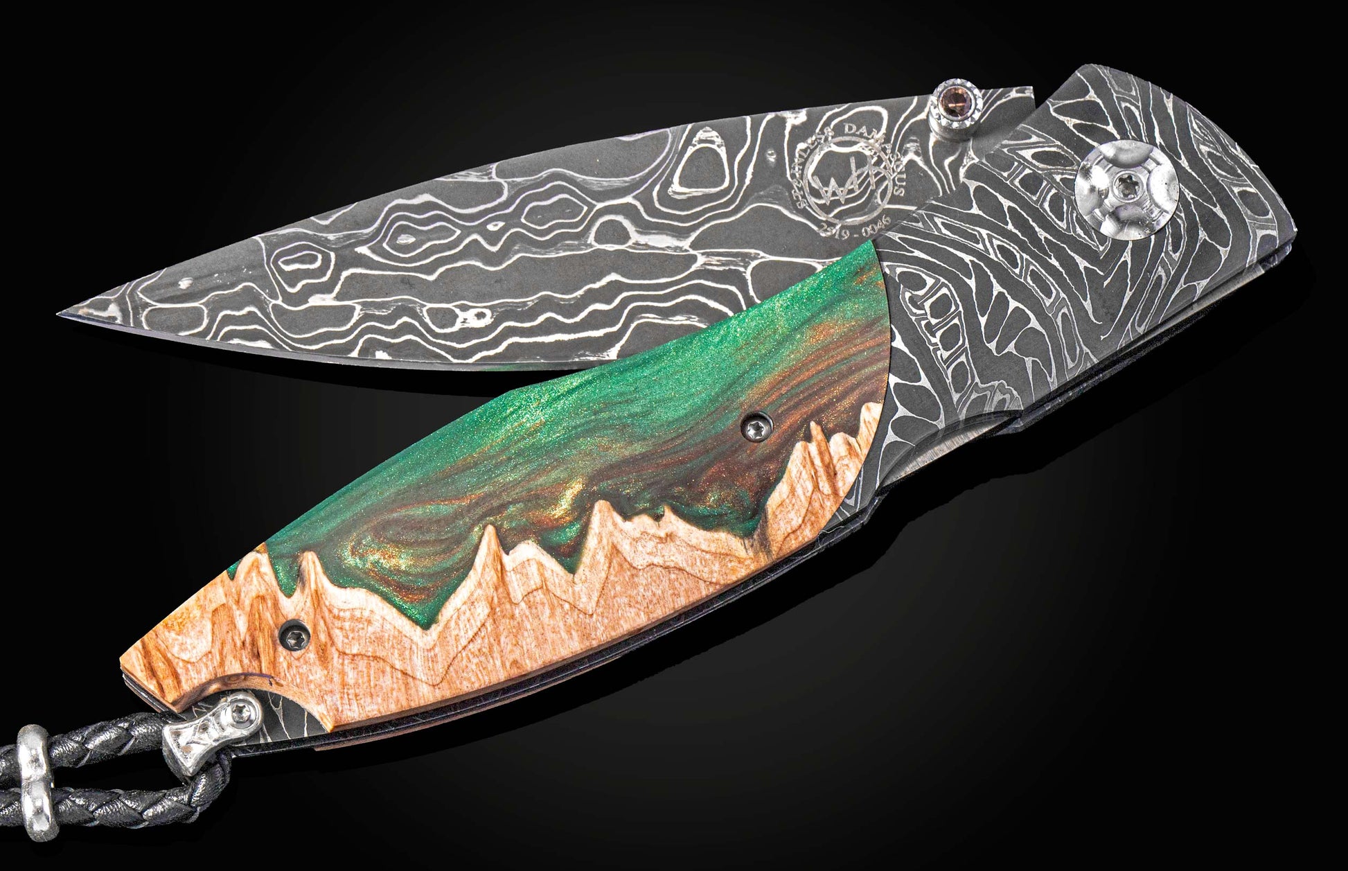 Folding knife with a decorative handle on a black background