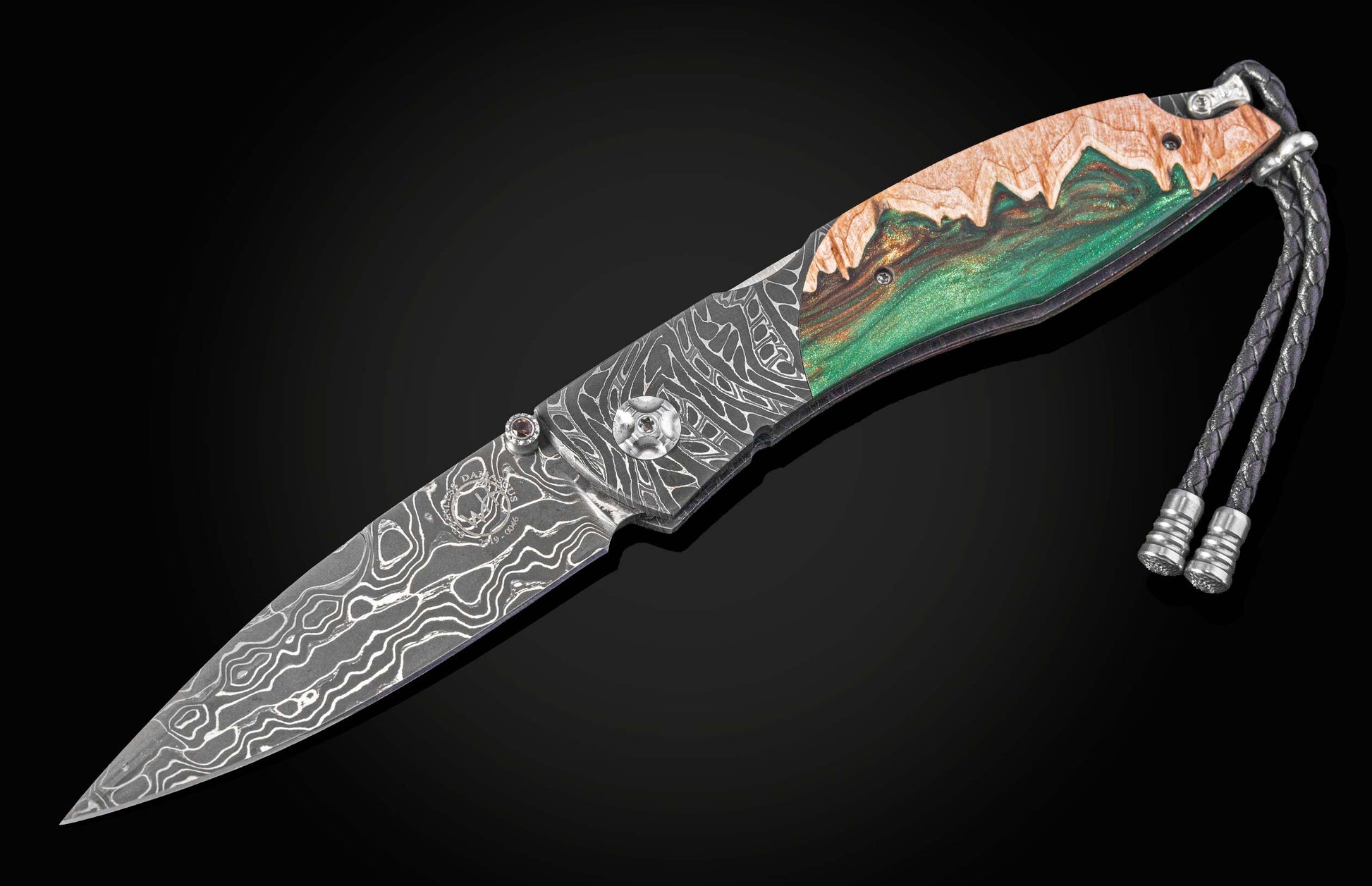 Folding knife with decorative handle on a black background