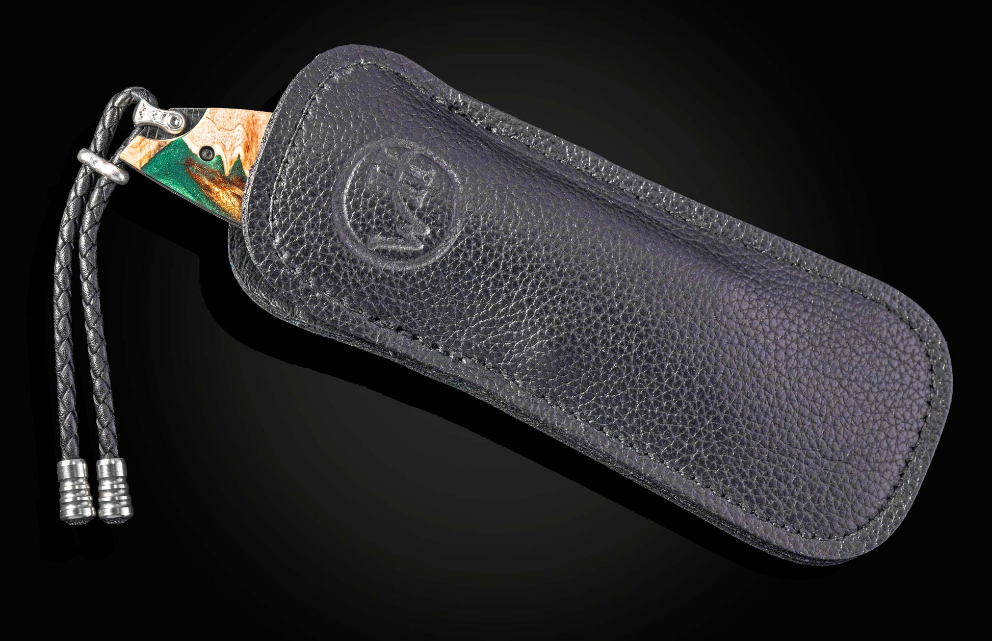 Black leather case with a brand logo on a dark background