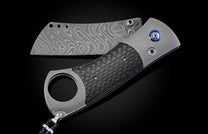 Titanium, carbon fiber, and damascus steel cigar cutter from William Henry