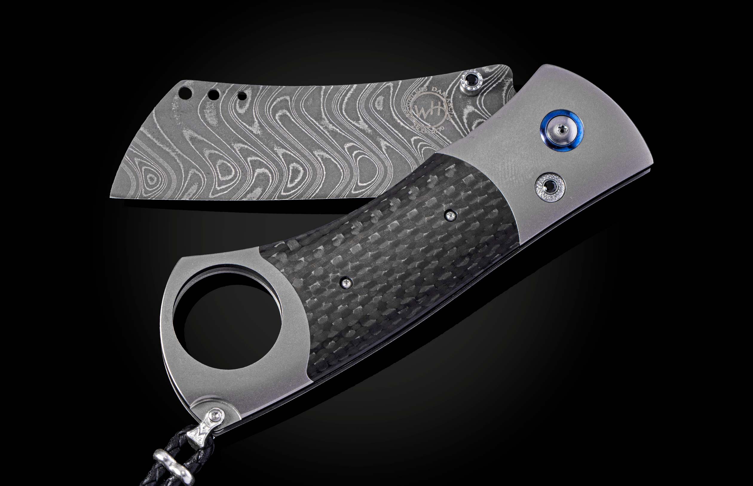 Titanium, carbon fiber, and damascus steel cigar cutter from William Henry