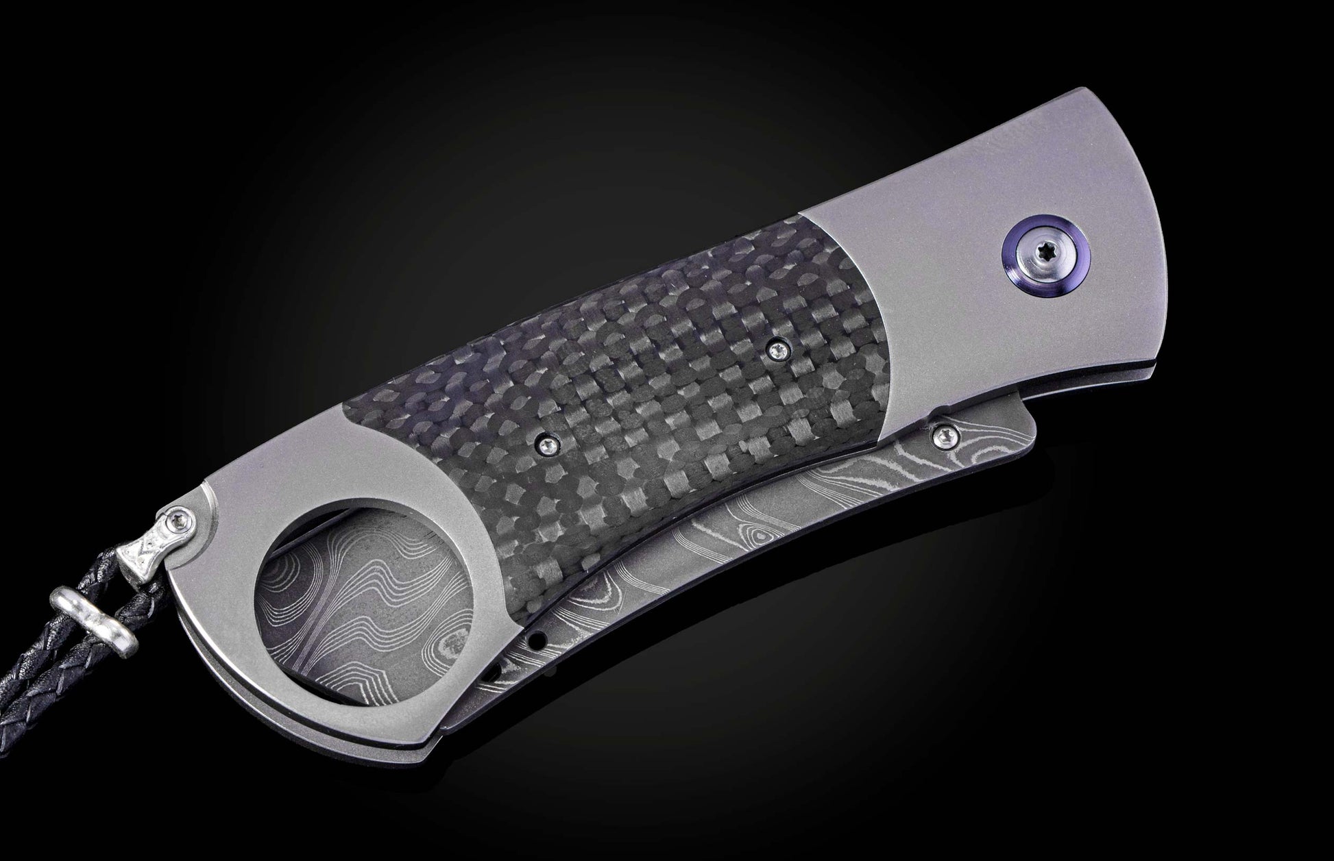 Titanium, carbon fiber, and damascus steel cigar cutter from William Henry