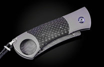 Titanium, carbon fiber, and damascus steel cigar cutter from William Henry