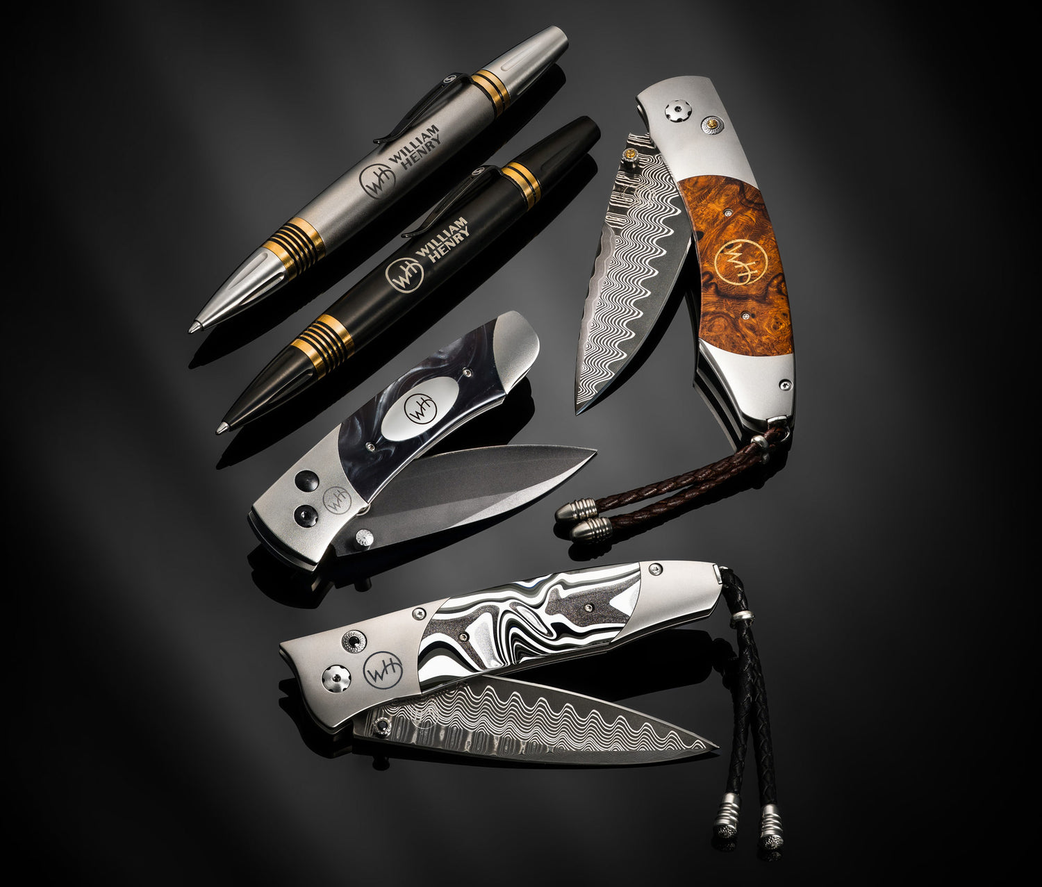 Collection of pocket knives and pens on a dark background