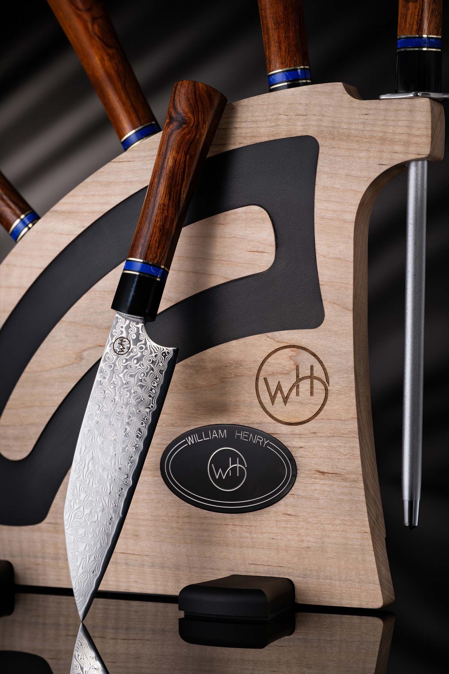 Close-up of a knife with wooden handle and metal blade on a dark background
