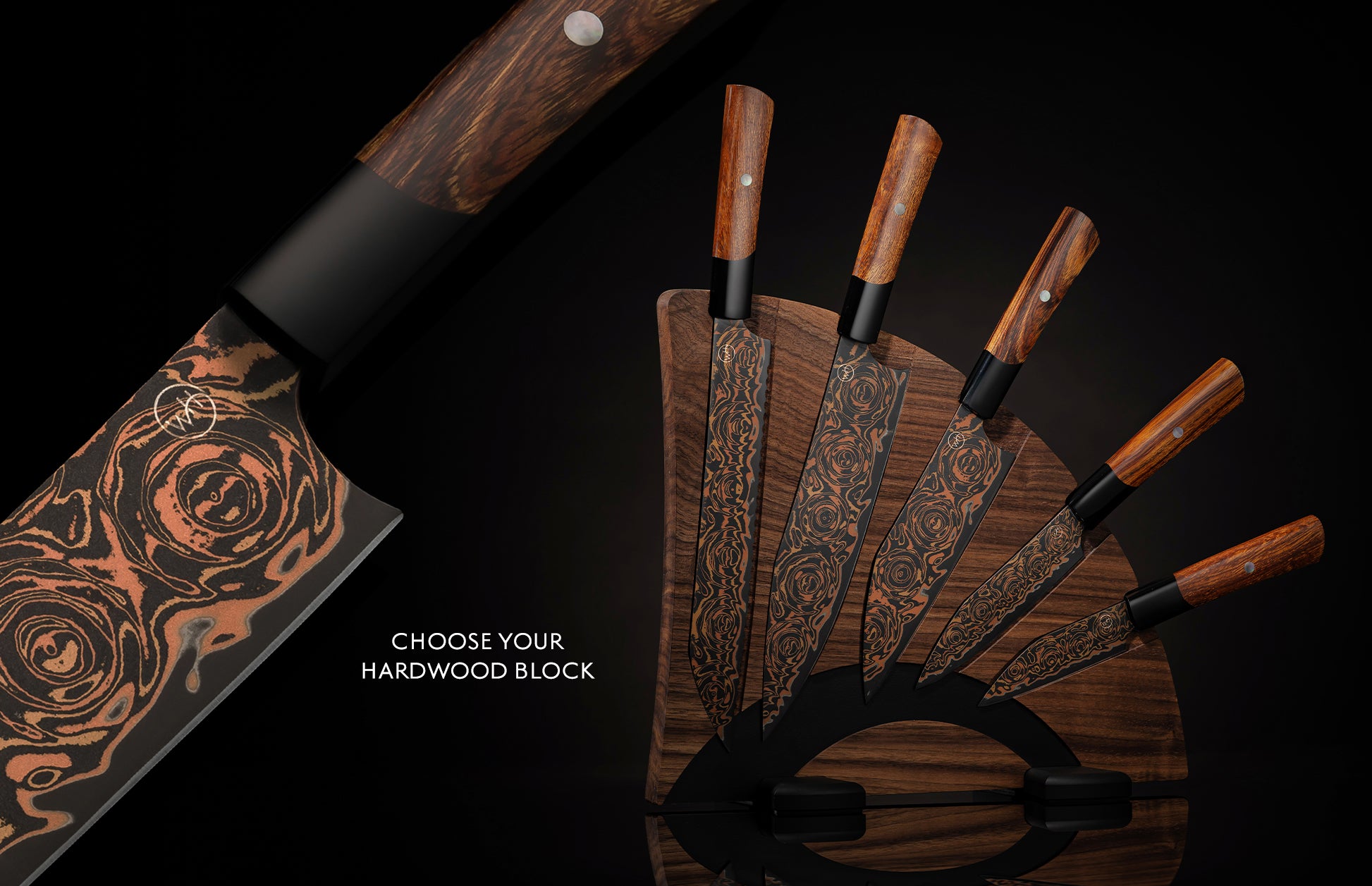 Set of chef knives with black and copper flare pattern blades and wooden handles, presented in a dark wood block.