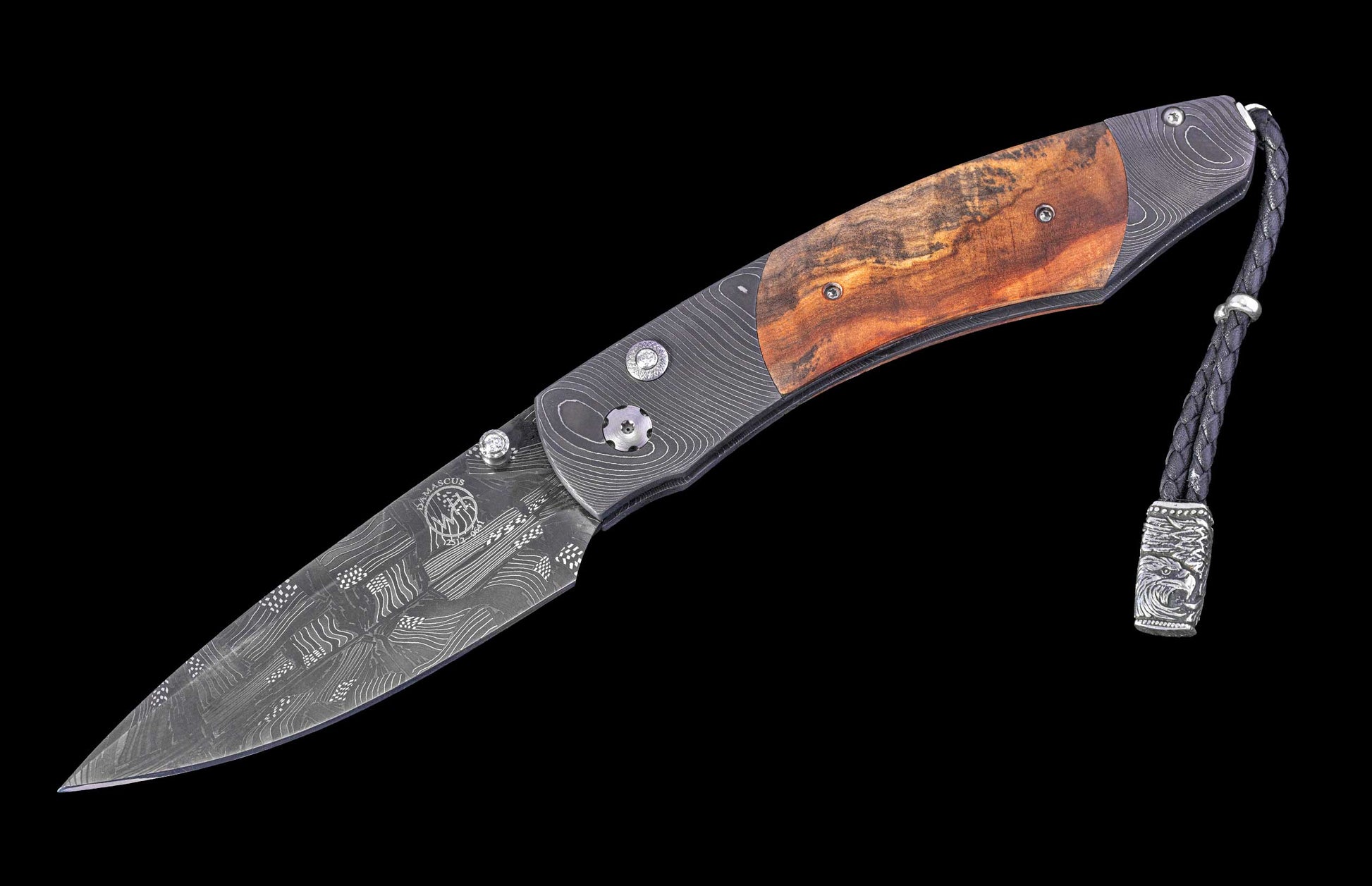 Folding knife with wooden handle and damascus blade on a black background