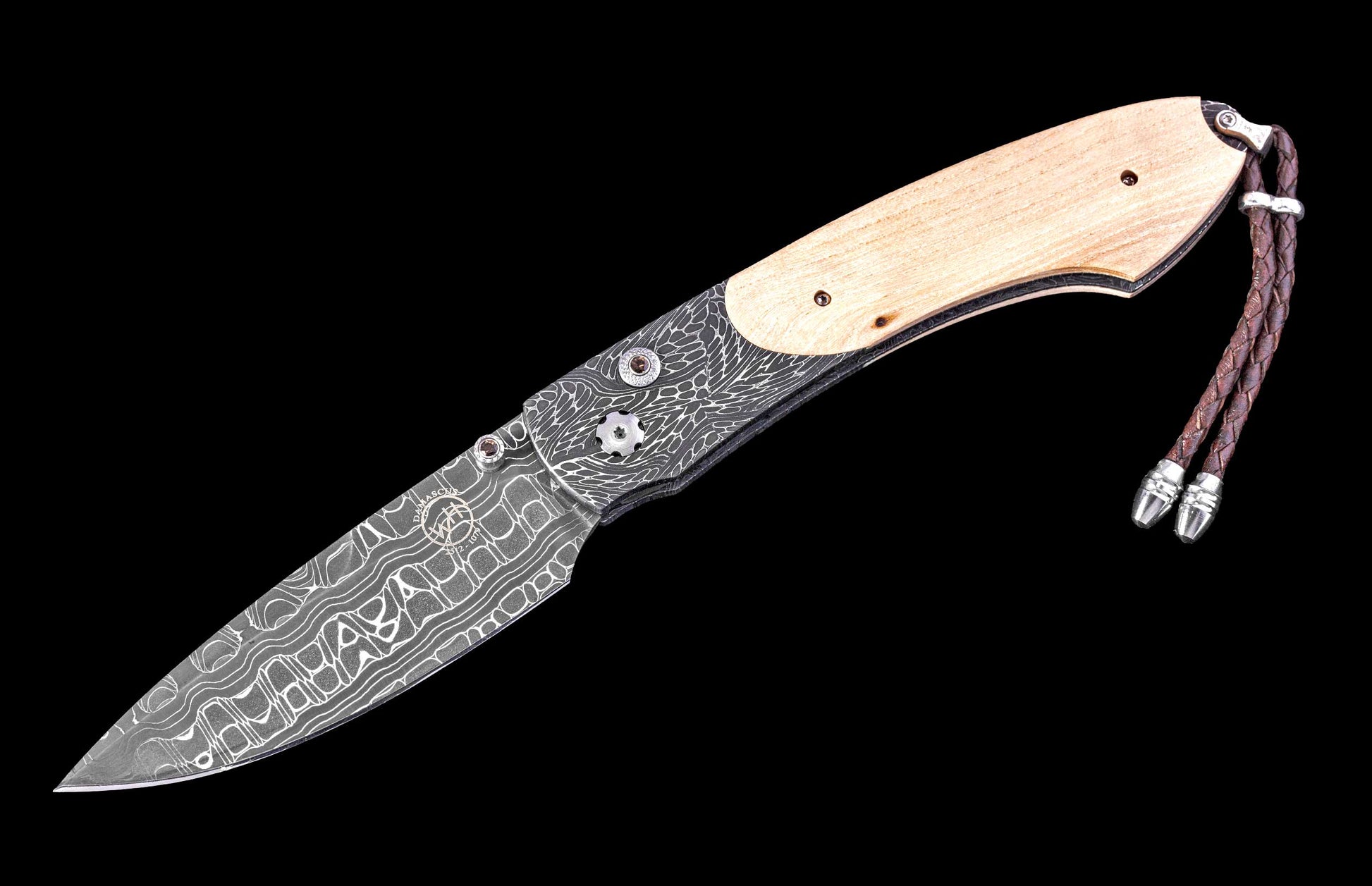 Folding knife with wooden handle and damascus steel blade on a black background