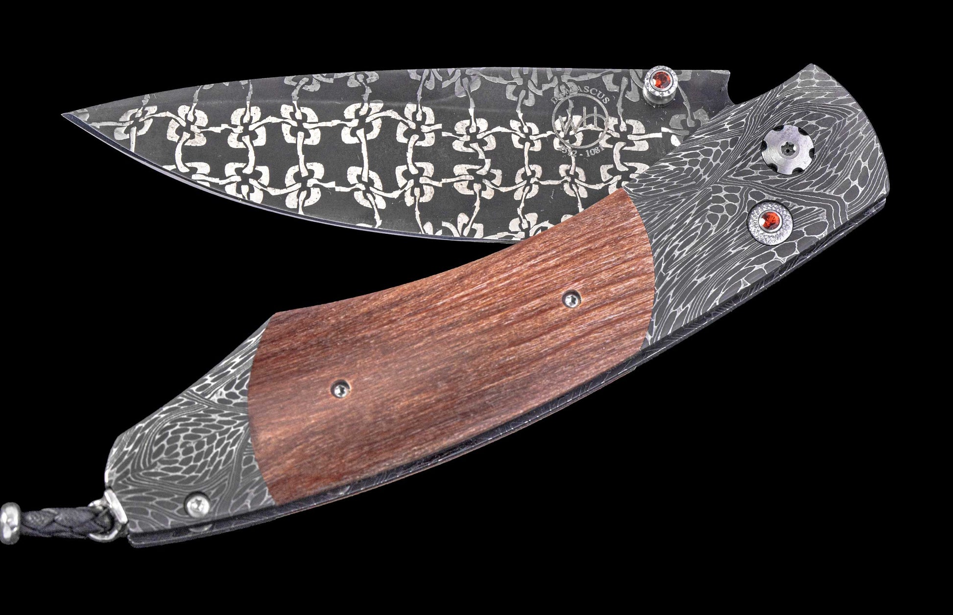 William Henry knife with wooden handle and damascus steel blade on a black background