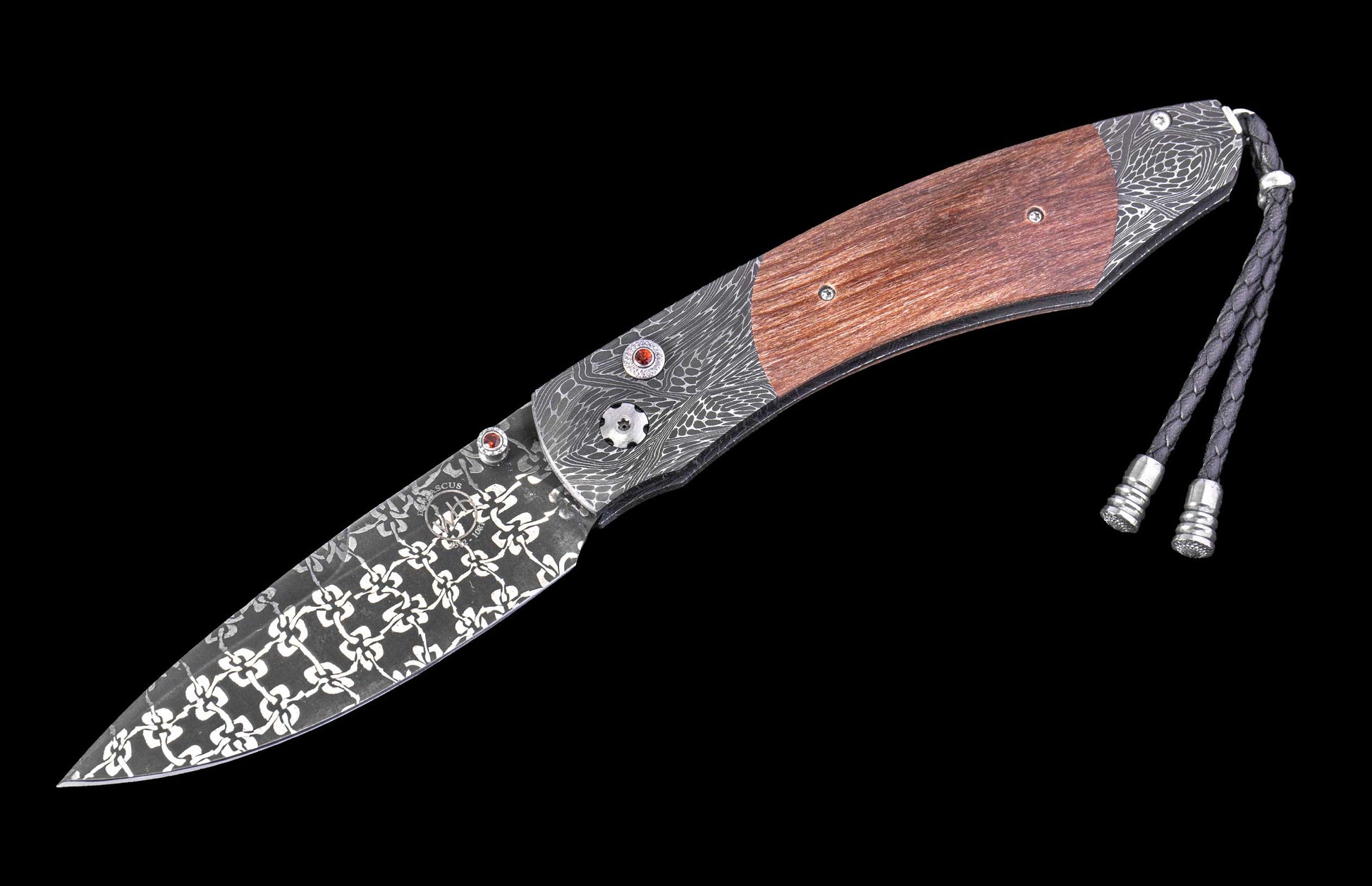 William Henry knife with wooden handle and damascus steel blade on a black background