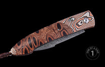 Closed automatic knife with brown exotic wood handle, black oval patterns, copper and silver Damascus bolster, Damascus steel blade, and braided leather lanyard.