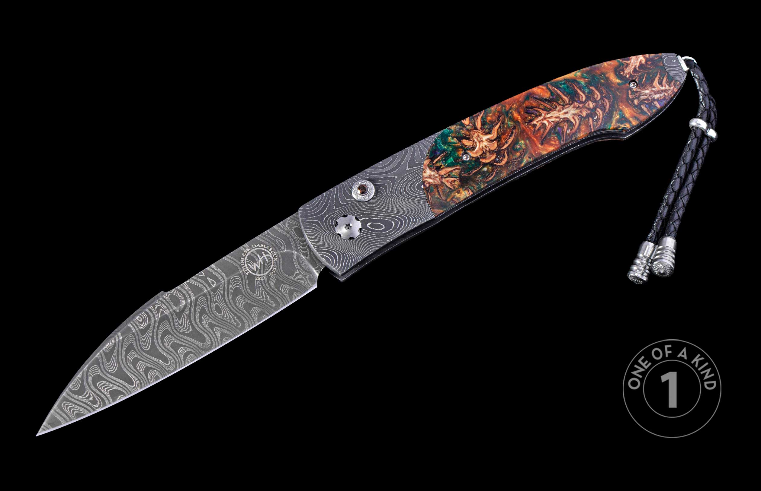 Autoknife with a wavy Damascus steel blade featuring an engraved emblem, a vibrant green and orange resin handle with organic inclusions, and a black braided leather lanyard.