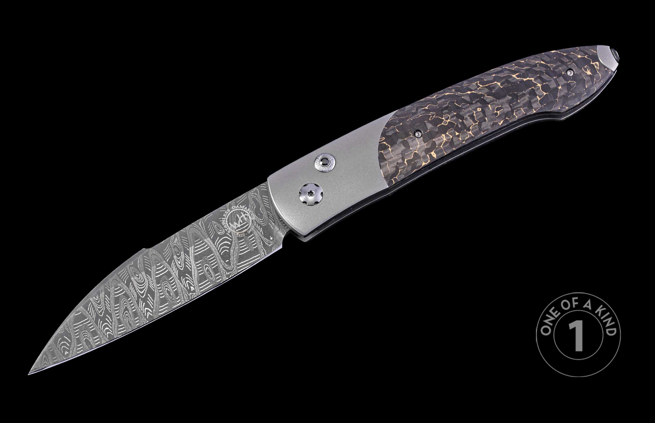 Automatic knife with stainless Damascus steel blade, silver frame, and dark handle with gold shattered pattern.