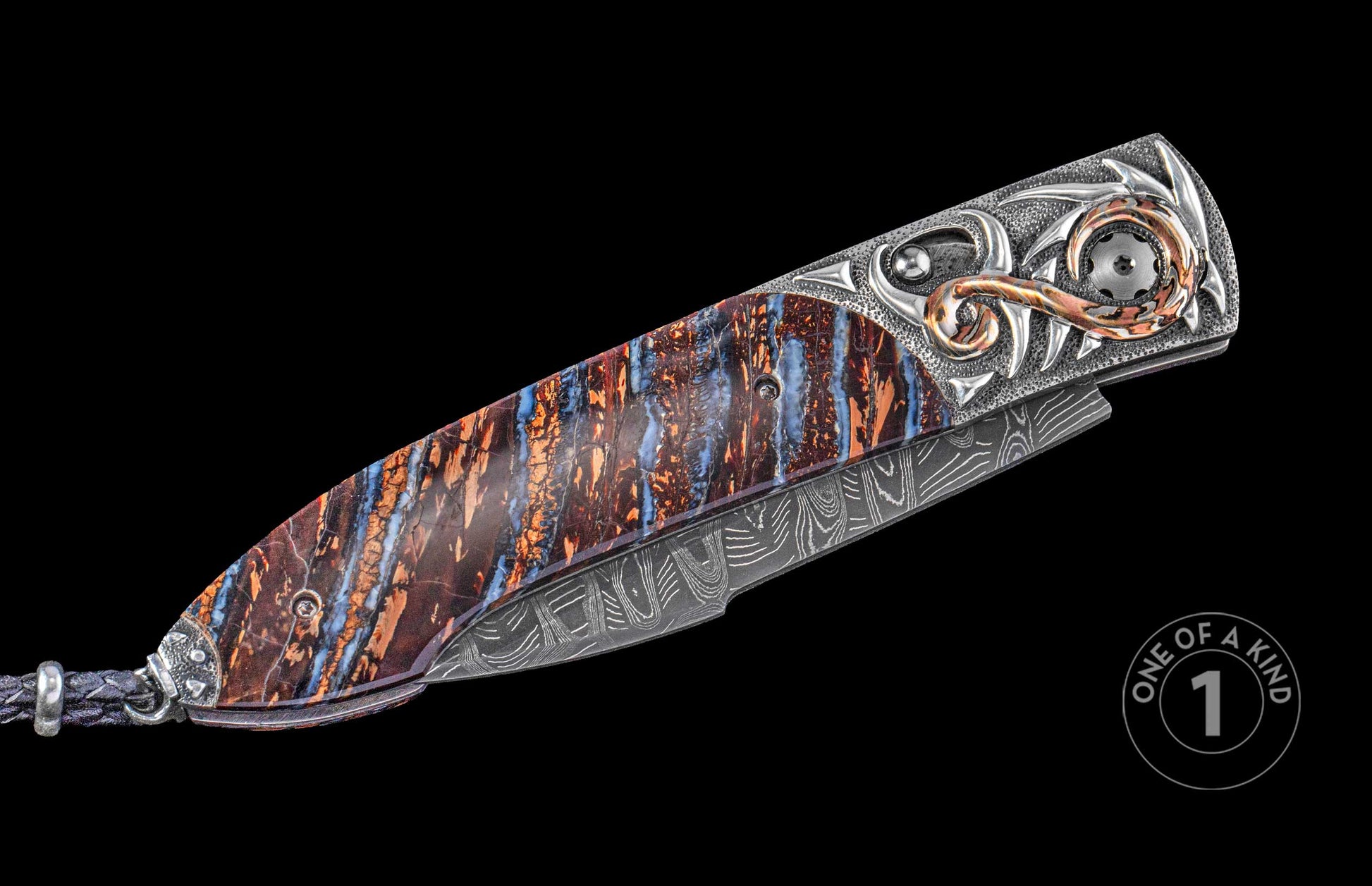 Side view of an auto knife with a rich blue and brown patterned handle, ornate silver and copper metalwork, and a Damascus blade.