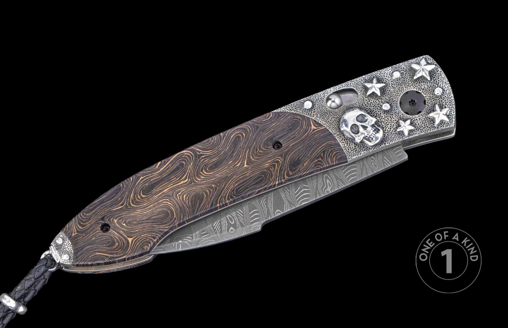 Ornate autoknife with a dark wavy handle, textured silver end featuring a skull and stars, and a Damascus blade.