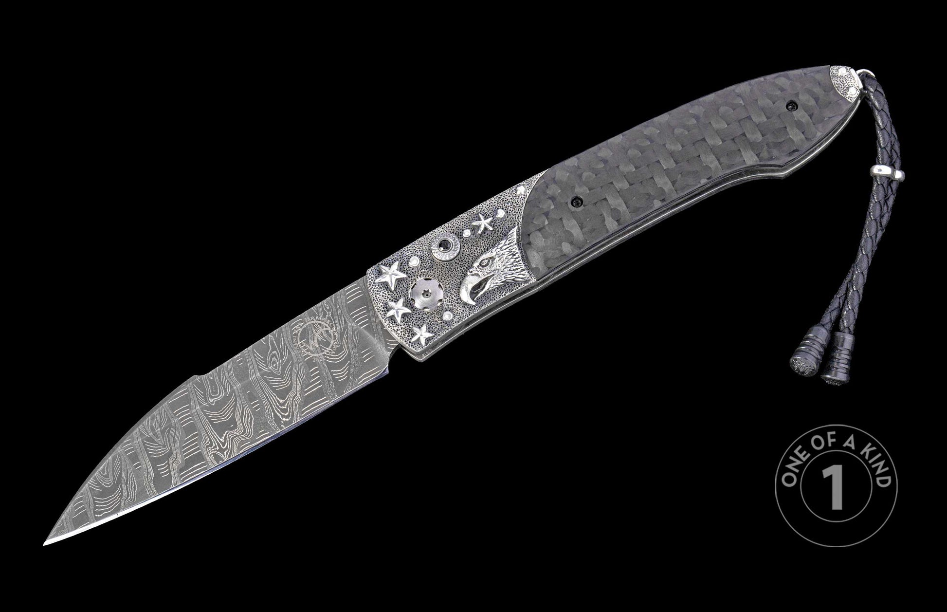 Automatic folding knife with a patterned Damascus blade, silver-toned eagle head and star-embellished handle, carbon fiber scales, and braided leather lanyard.