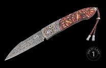 Folding knife with Damascus steel blade, ornate silver and rose gold-accented handle, red gemstone, wood inlay, and braided leather lanyard.