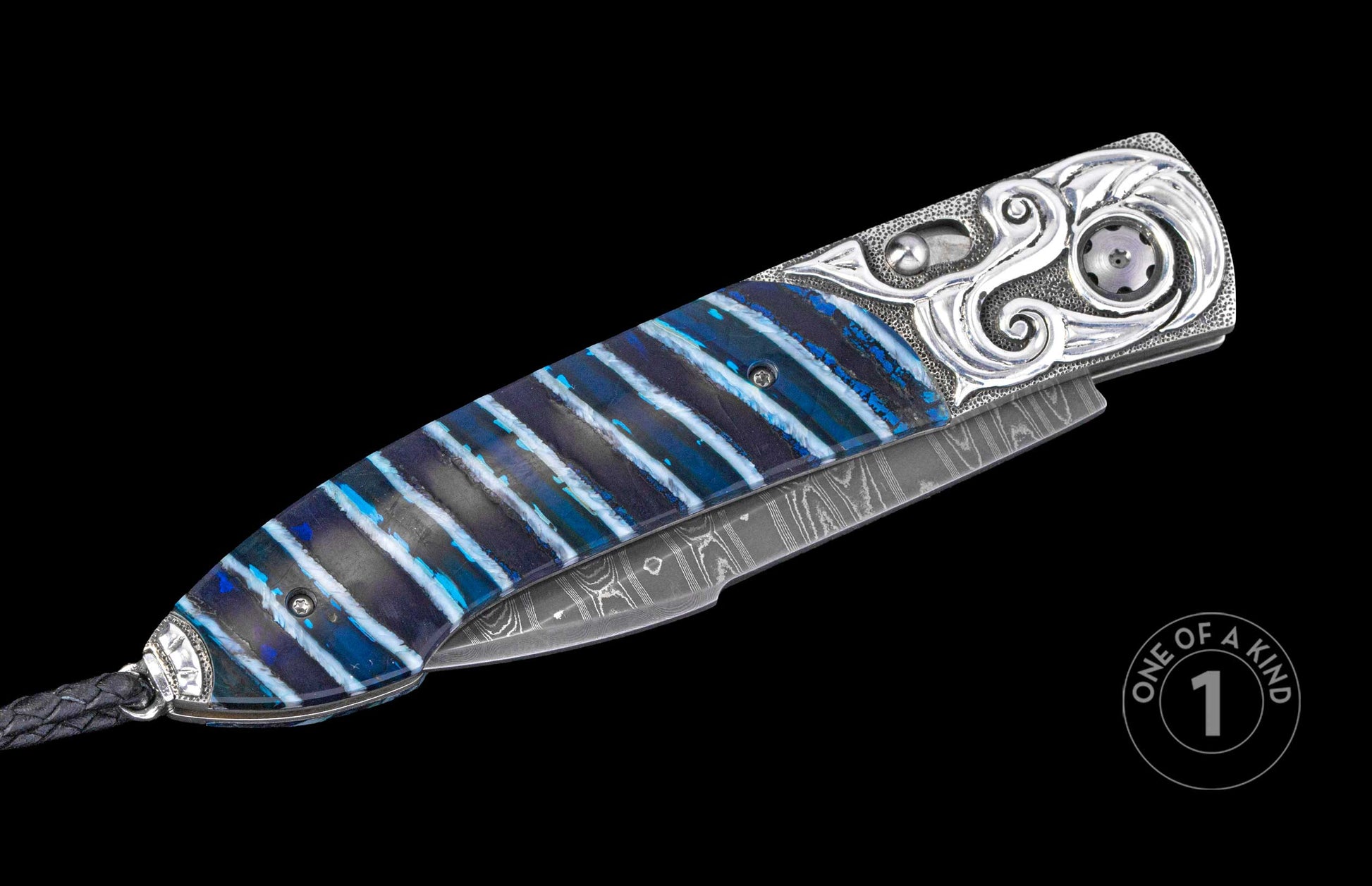 Custom folding knife with a blue and white striped handle, ornate silver-toned engraving, and Damascus steel blade.