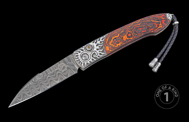 Automatic knife with a wavy Damascus steel blade and an orange and black patterned handle, featuring ornate silver bolsters, a yellow jewel, and a braided leather lanyard.