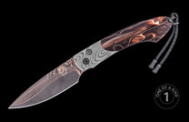 Damascus steel knife with wavy pattern and amber resin handle by Monarch, featuring braided lanyard and sleek tapered blade, side view on black background