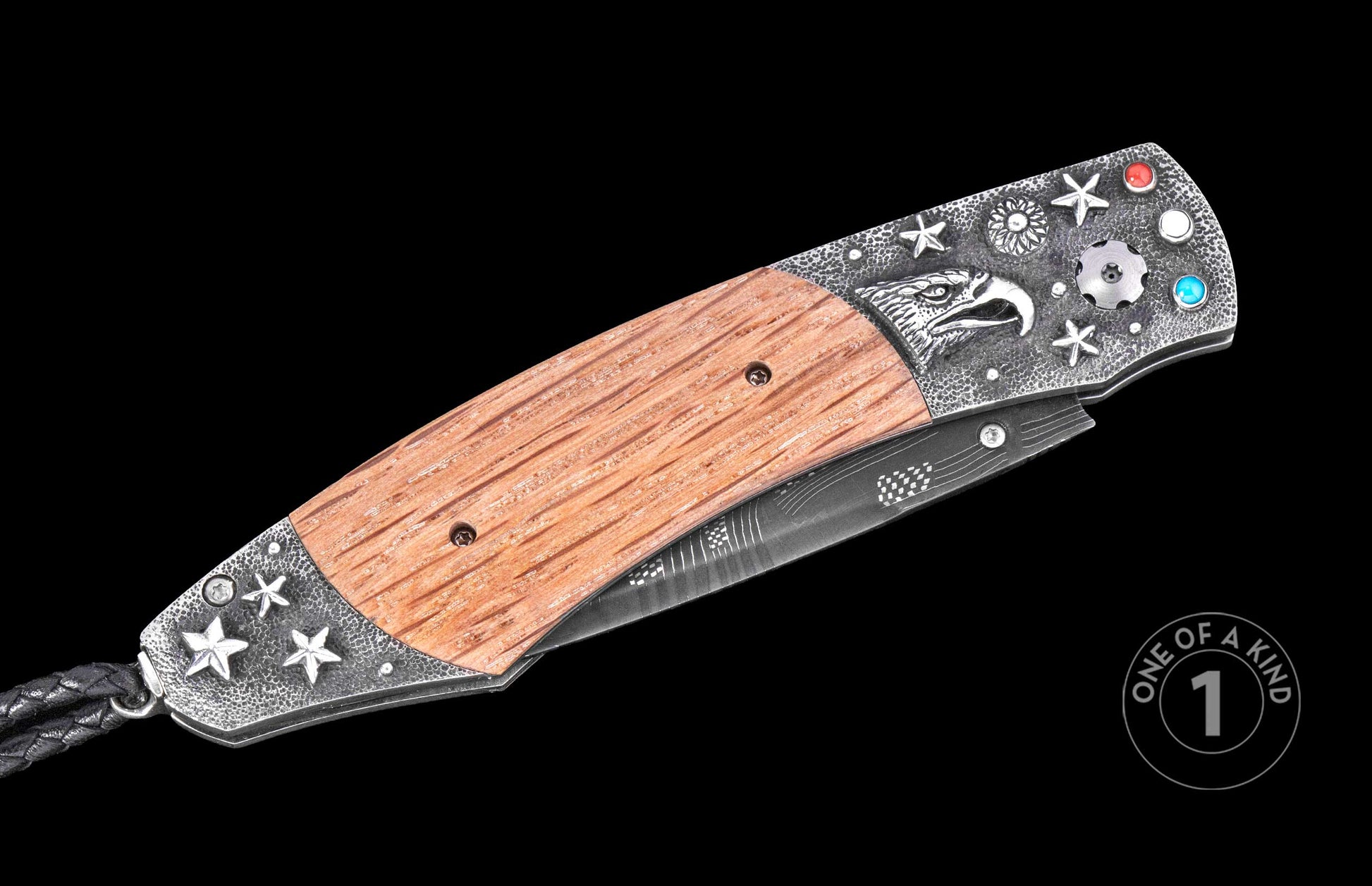 Luxury folding knife with wooden handle and textured metal accents featuring eagle engraving and star motifs, side view