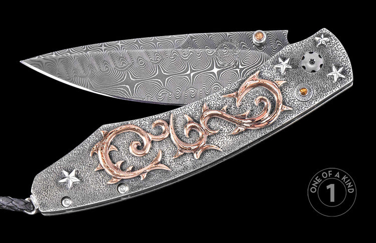 Damascus steel folding knife with textured silver handle, copper scrollwork, star inlays, and black lanyard, one of a kind