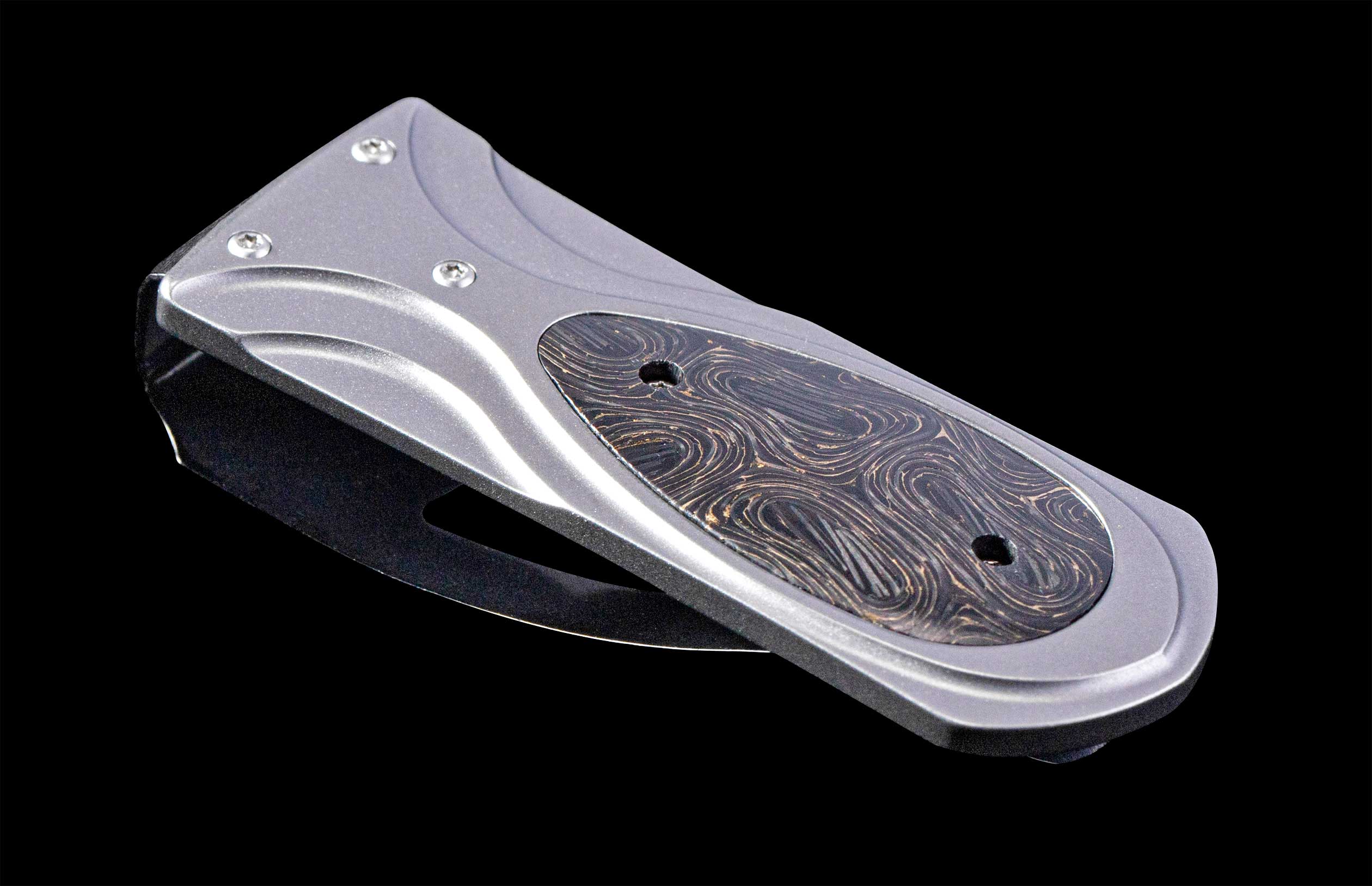 William Henry money clip on back background