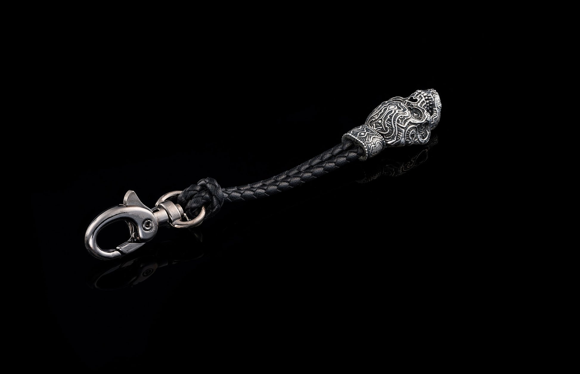 William Henry Kay Fob with a sculpted sterling silver sugar skull, a round-braided black leather cord, and stainless steel hook.