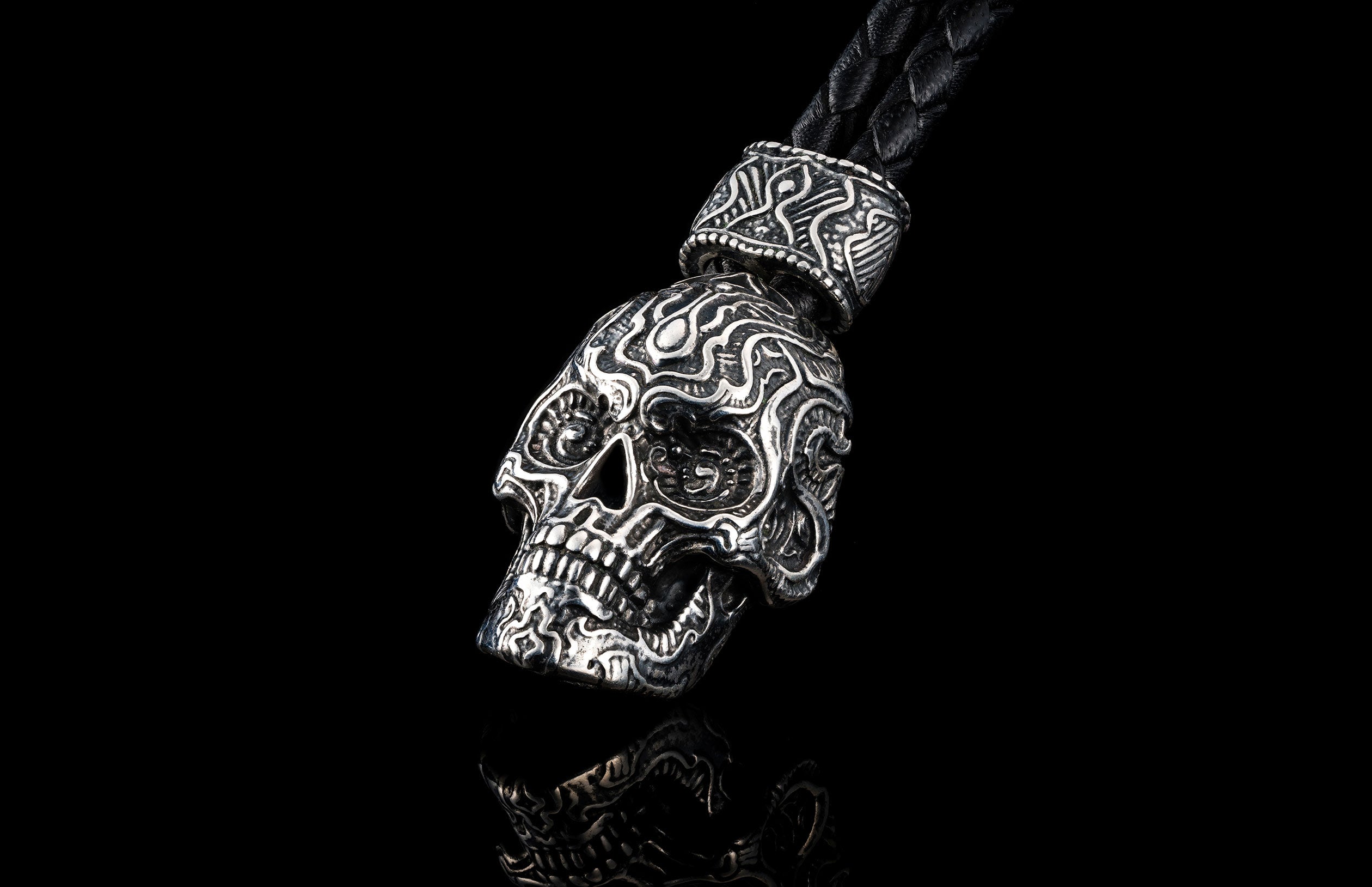 William Henry Kay Fob with a sculpted sterling silver sugar skull, a round-braided black leather cord, and stainless steel hook.