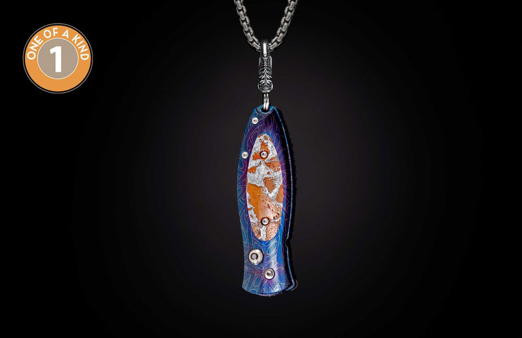 Blue and purple anodized knife with a textured orange and silver insert, hanging from a silver chain.