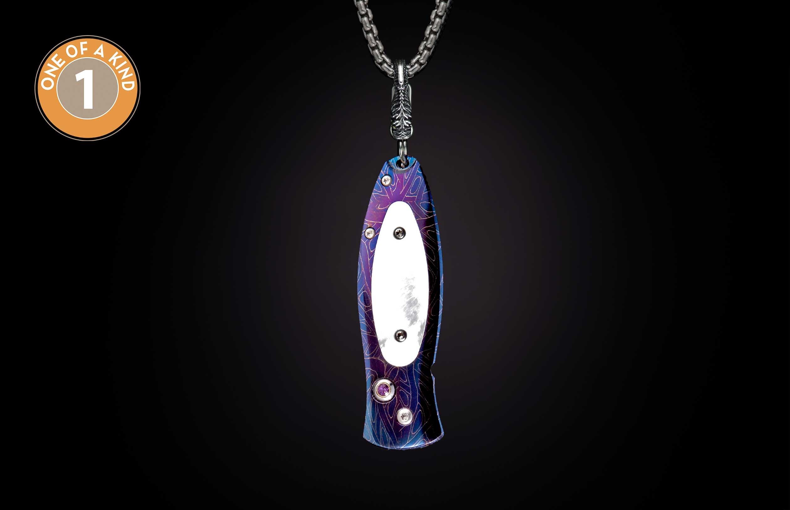 Purple and blue patterned metal knife hanging on a silver chain, with a white inlay, screws, purple gem, and 'ONE OF A KIND 1' logo.