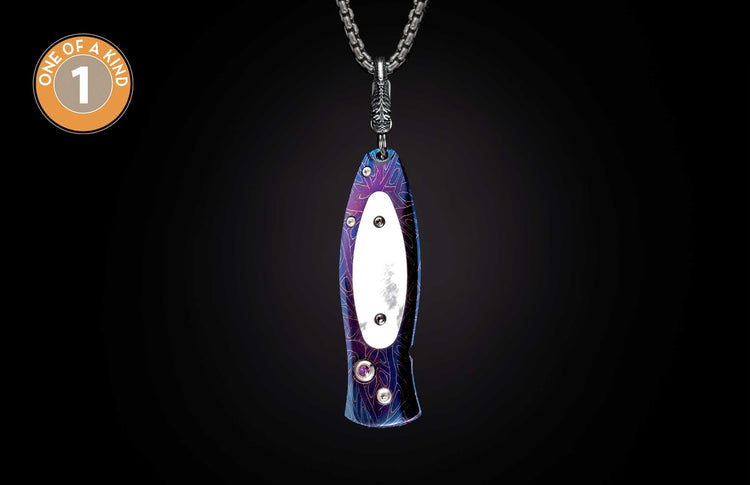 Purple and blue patterned metal knife hanging on a silver chain, with a white inlay, screws, purple gem, and 'ONE OF A KIND 1' logo.