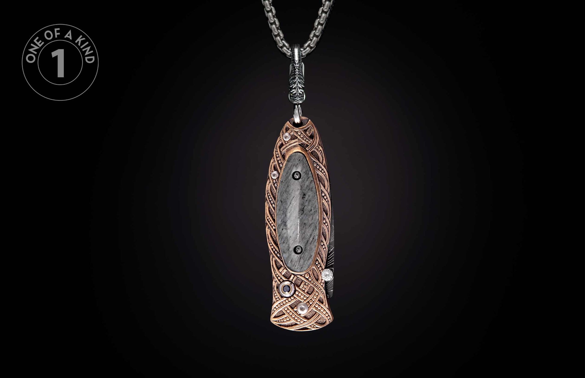 Ornate knife pendant featuring a gray stone inlay and bronze Celtic knotwork design on a silver chain.