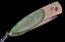 Green jade pocket knife by Gump's Exclusive with patterned Damascus steel and braided lanyard.
