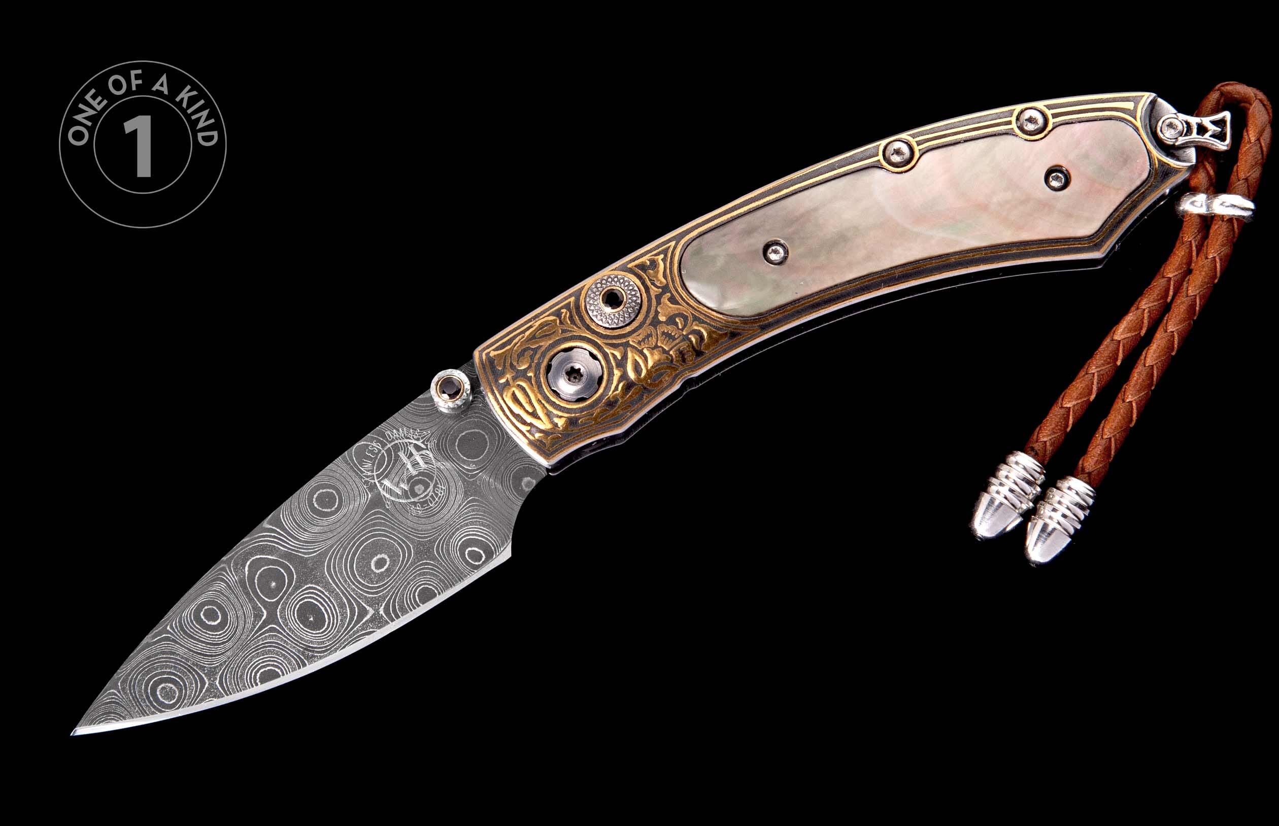 Ornate folding knife with a damascus steel blade, mother-of-pearl handle scales, and engraved gold-tone bolsters, featuring a brown leather lanyard.