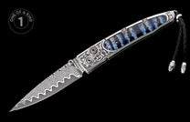 Ornate open folding knife featuring wavy Damascus steel blade, silver handle with blue striped inlay, and sapphire accents.