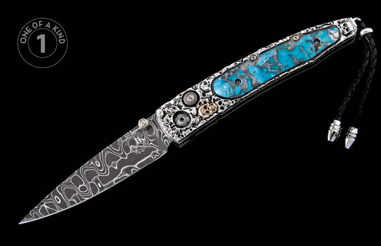 Ornate folding knife with Damascus blade, turquoise inlay, intricate silver handle featuring skulls, gears, and a black braided leather lanyard.